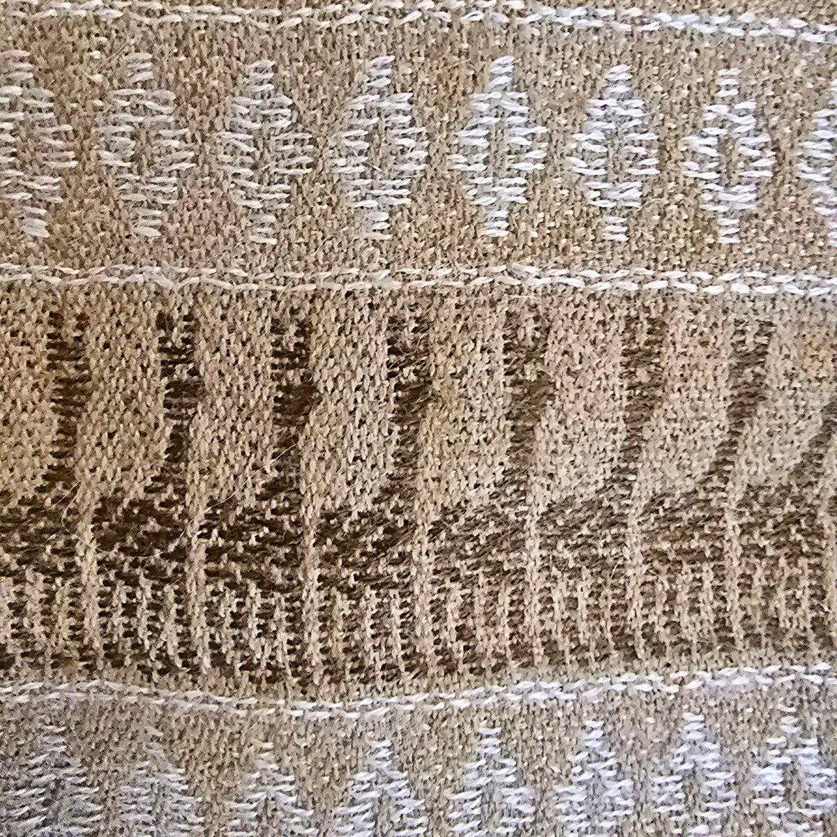 Woven Andean pattern detail on camel baby alpaca scarf