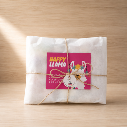 Andean pom-pom headband in Happy Llama gift packaging