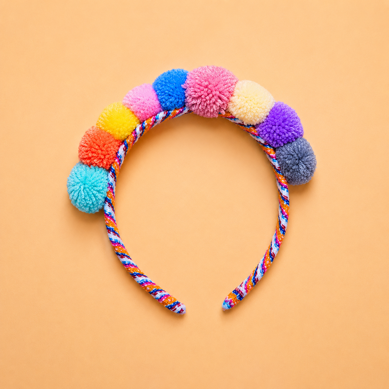Pastel Mix Andean pom-pom headband handmade in Peru