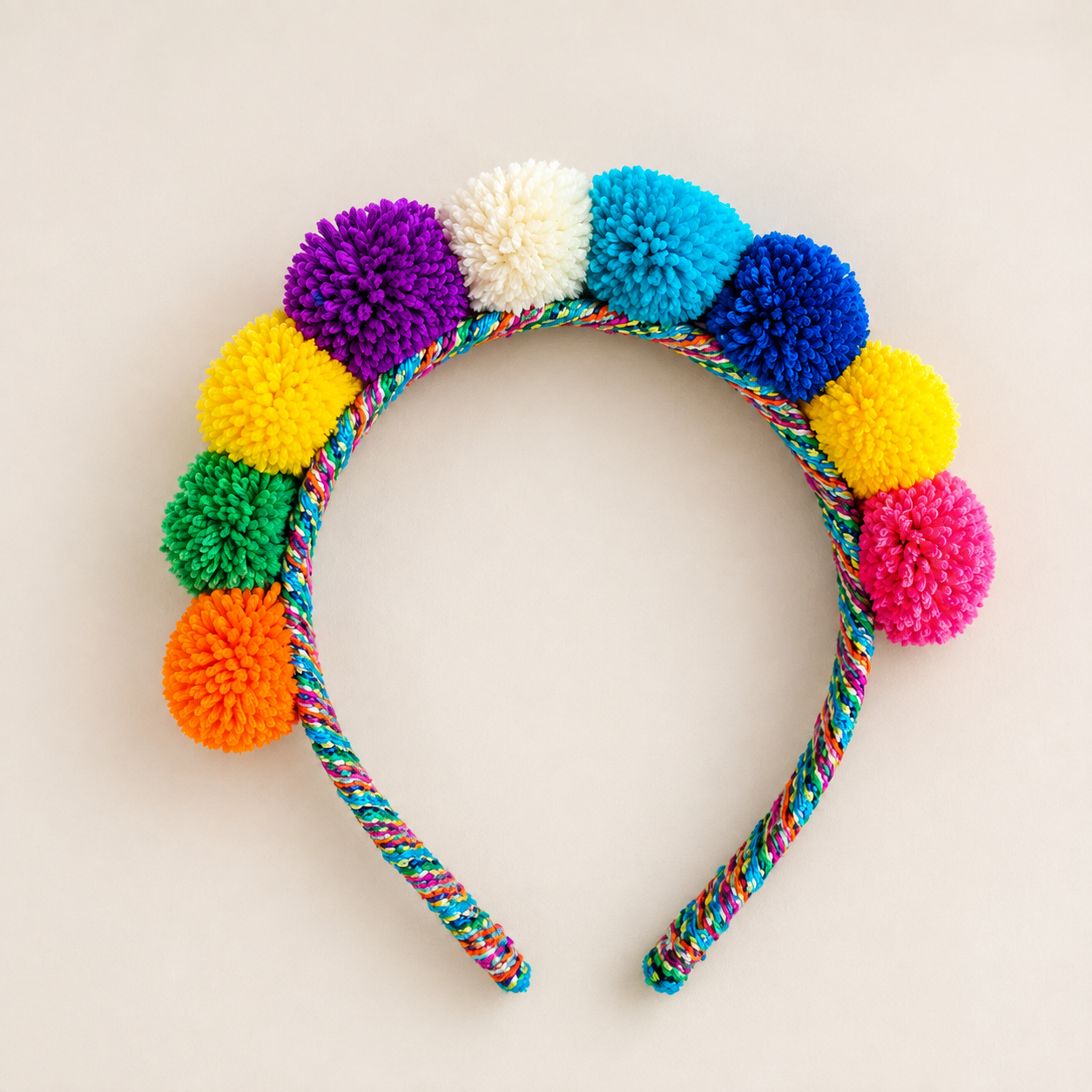 Rainbow Mix Andean pom-pom headband handmade in Peru