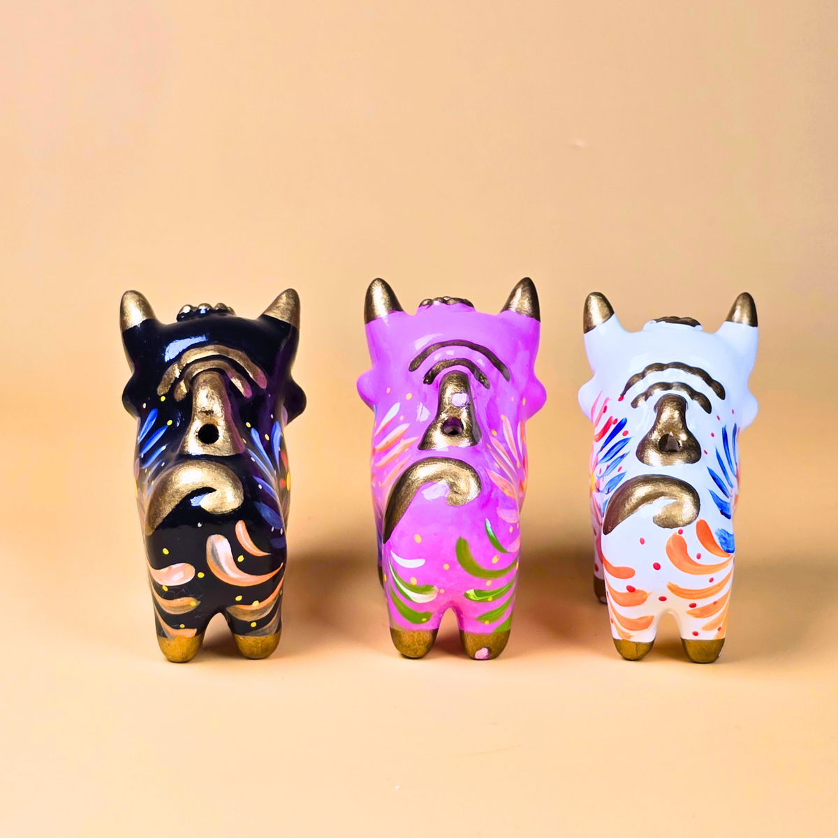 Black, pink and white Torito de Pucará handmade Peruvian ceramic bulls