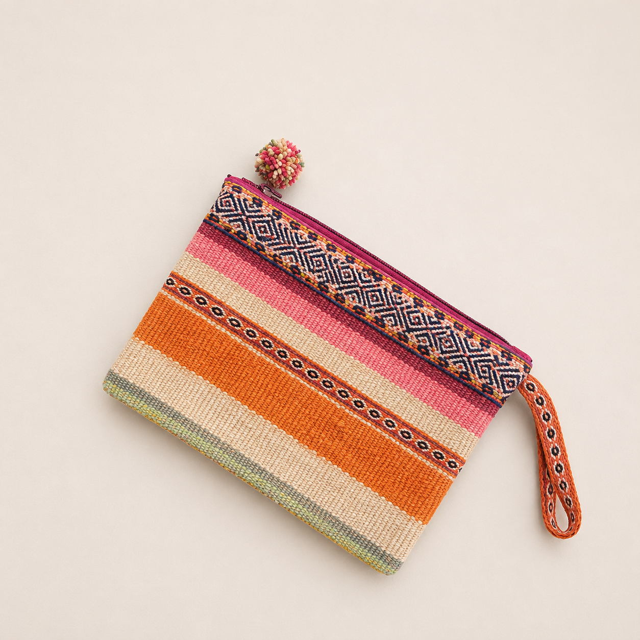 Handmade orange woven pouch with traditional Peruvian design.