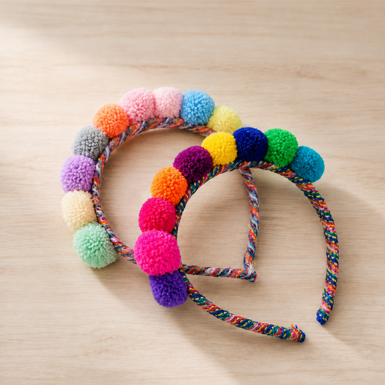 Close-up of colourful handmade Andean pom-pom headband