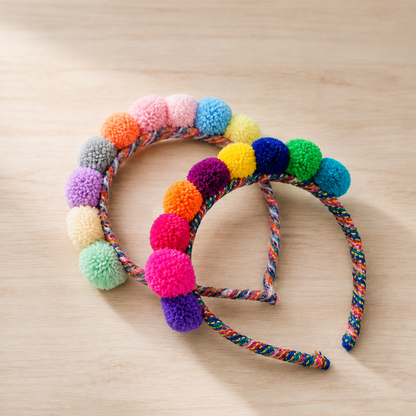 Close-up of colourful handmade Andean pom-pom headband